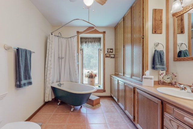 112 Ten Pines Rd, Torreon, NM 87061 - full bath featuring a freestanding bath, a ceiling fan, double vanity, tile patterned floors, and baseboards