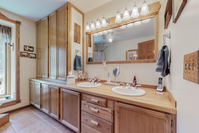 112 Ten Pines Rd, Torreon, NM 87061 - full bathroom with double vanity, tile patterned floors, and a ceiling fan