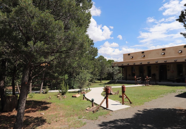 view of home's community featuring a yard