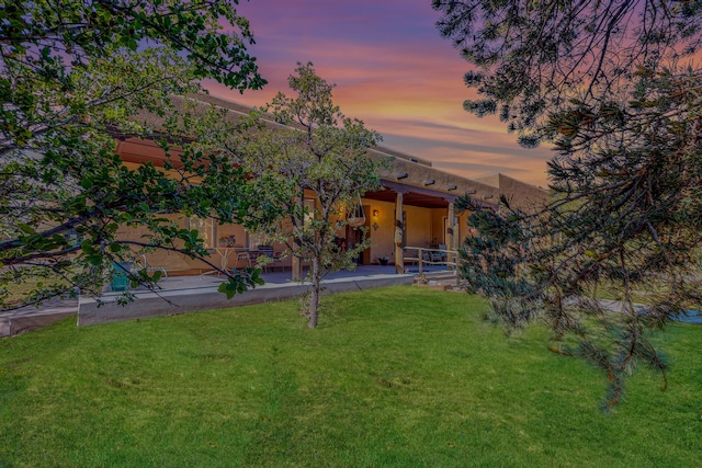 yard at dusk with a patio