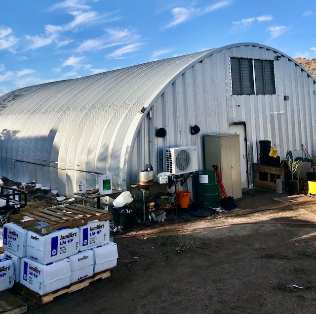 view of outdoor structure with ac unit