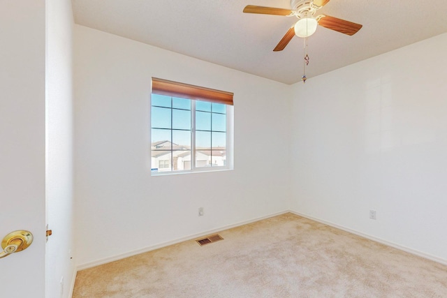 empty room with light carpet and ceiling fan