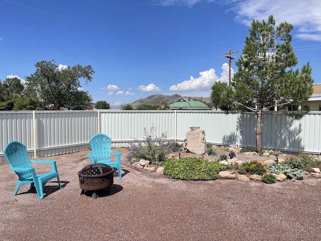 view of patio / terrace with an outdoor fire pit