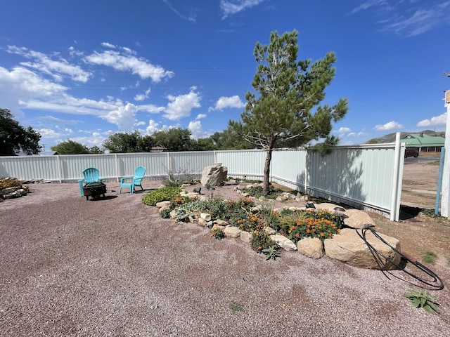 view of yard featuring a fire pit