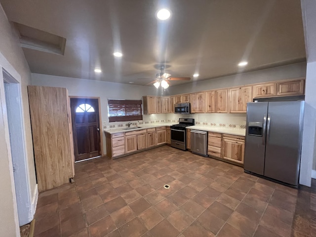 kitchen with sink, stainless steel appliances, and ceiling fan