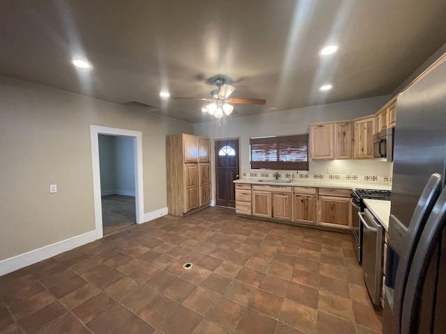 kitchen featuring light brown cabinetry, sink, ceiling fan, and appliances with stainless steel finishes