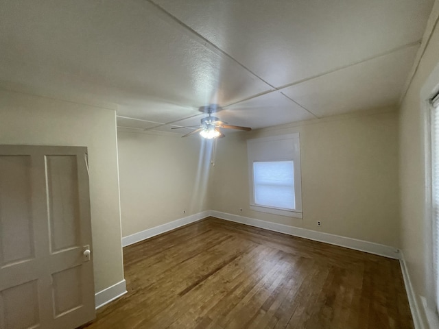 spare room featuring hardwood / wood-style flooring and ceiling fan