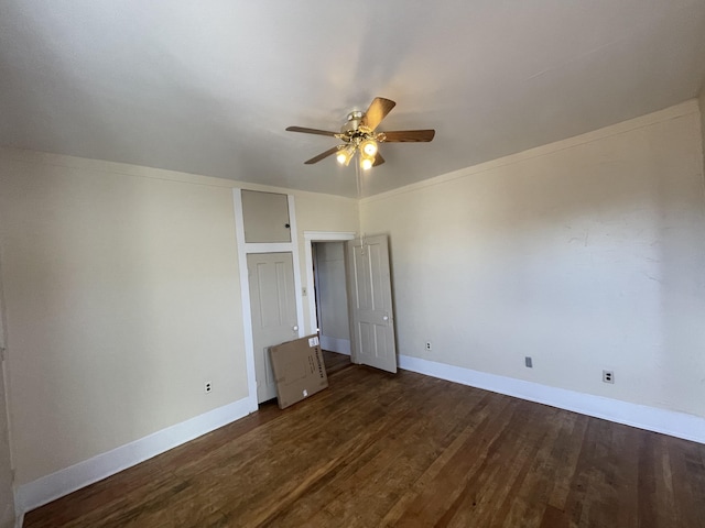 unfurnished bedroom featuring dark hardwood / wood-style floors and ceiling fan