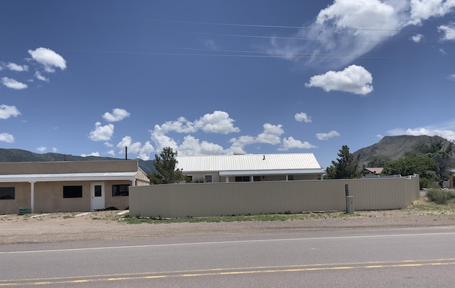 view of side of property with a mountain view