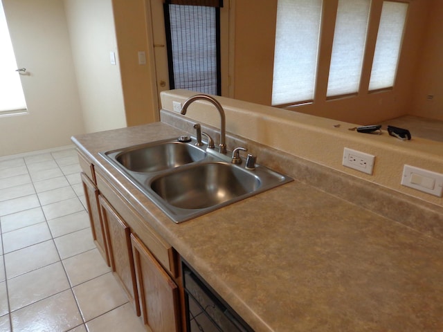 kitchen with light tile patterned flooring and sink