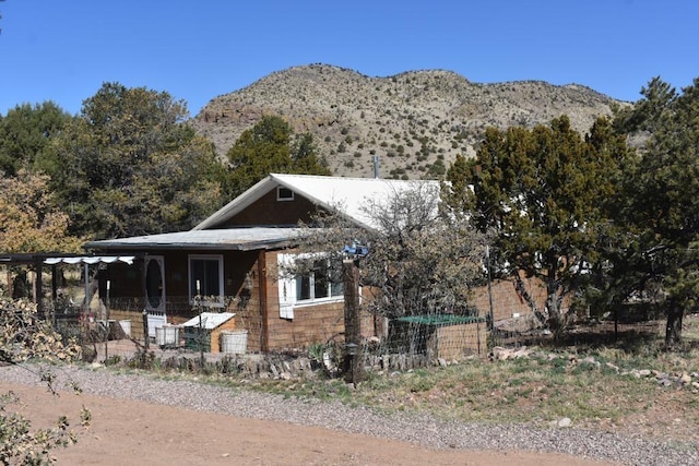 view of front of property with a mountain view