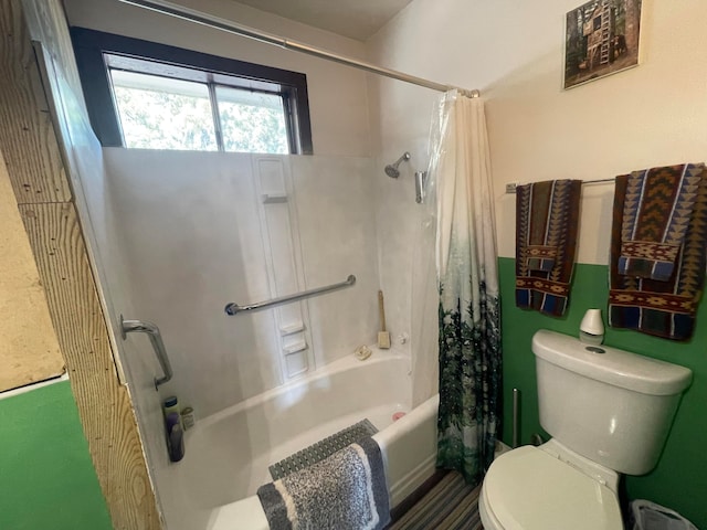 bathroom with toilet and shower / tub combo with curtain