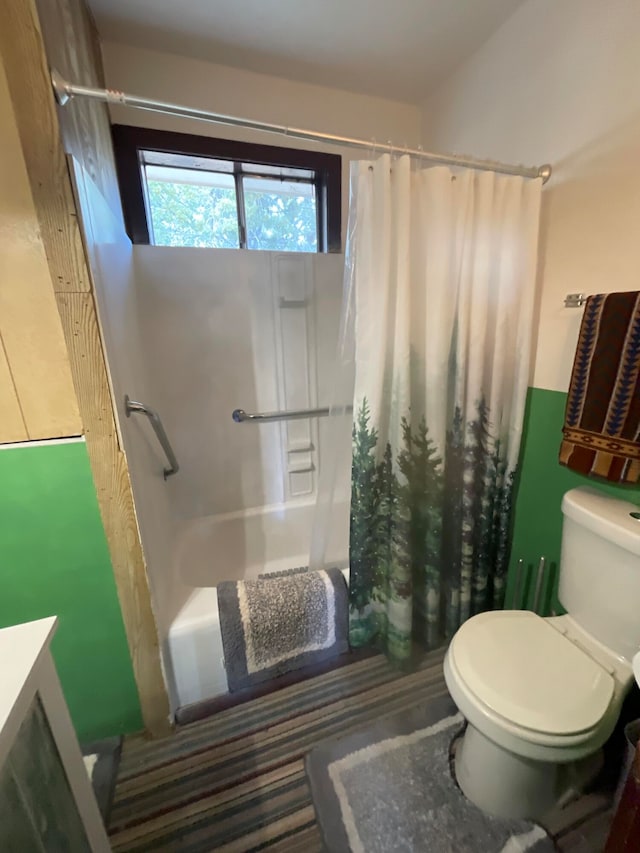 full bathroom featuring vanity, shower / tub combo, and toilet