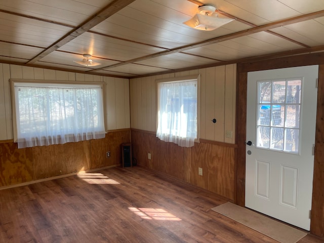 entryway featuring hardwood / wood-style flooring, wooden ceiling, and wooden walls