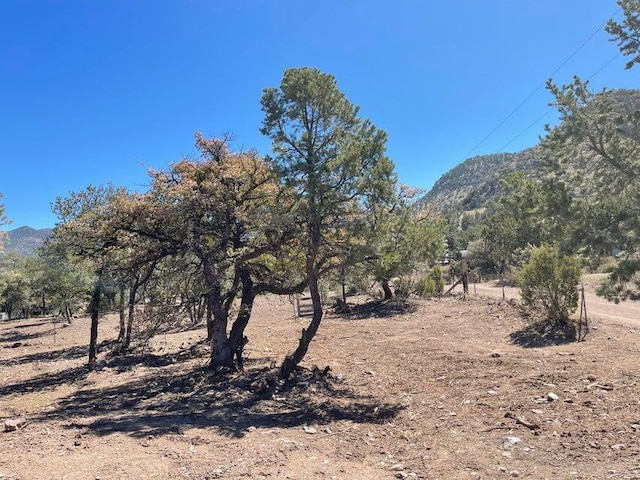 view of mountain feature with a rural view