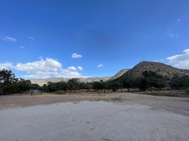 property view of mountains featuring a rural view