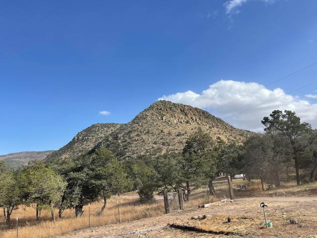 property view of mountains featuring a rural view