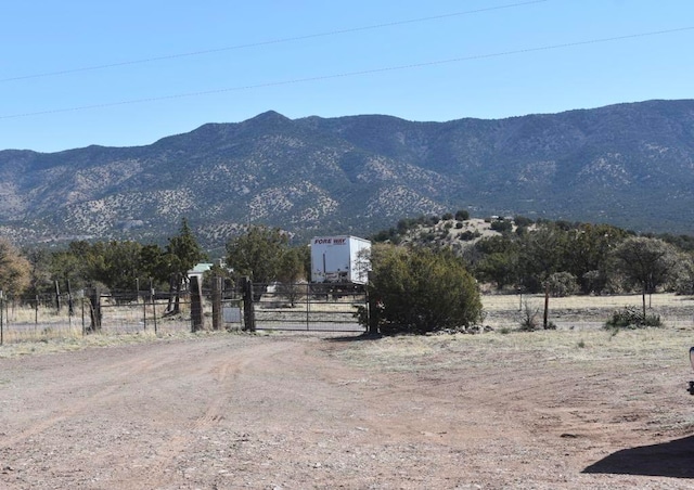 mountain view featuring a rural view