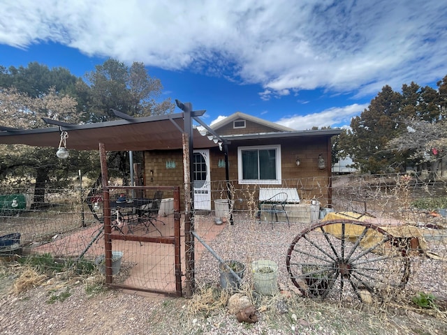 rear view of house featuring a patio