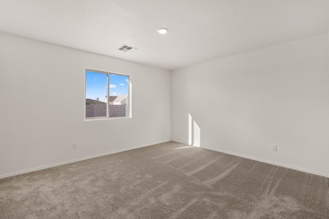 spare room featuring carpet floors