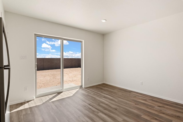 unfurnished bedroom featuring light colored carpet, sink, a closet, and ensuite bathroom