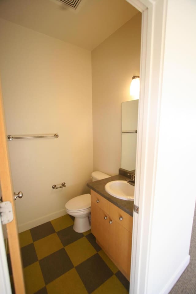 324 Broadway Blvd NE, Albuquerque, NM 87102 - bathroom featuring tile patterned floors, vanity, and toilet