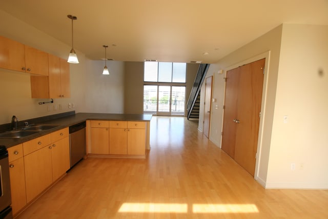 kitchen featuring light brown cabinetry, light hardwood / wood-style floors, kitchen peninsula, and stainless steel dishwasher