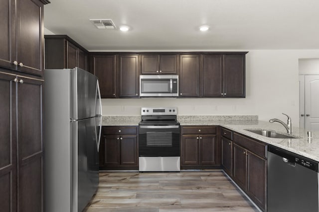 spare room featuring light hardwood / wood-style floors and ceiling fan