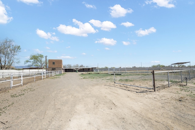 view of yard with a rural view