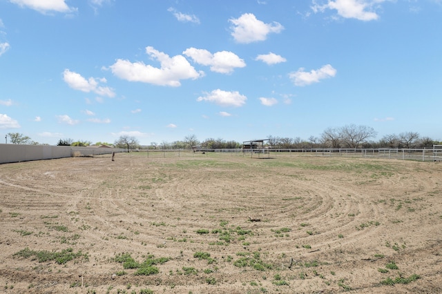 view of yard with a rural view