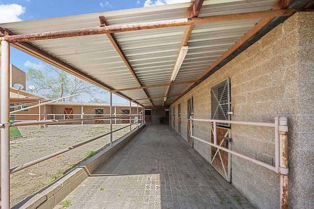 view of horse barn with an outdoor structure