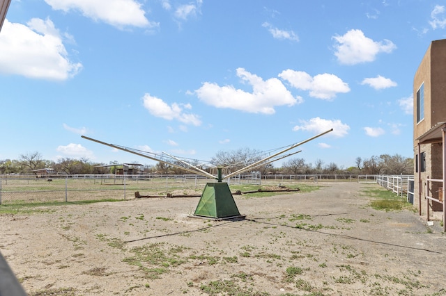 view of yard with a rural view