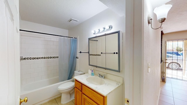 full bathroom featuring tile patterned flooring, a textured ceiling, toilet, shower / tub combo with curtain, and vanity