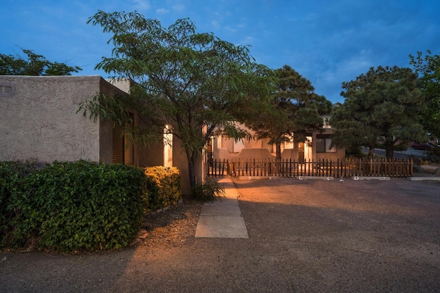 view of gate at dusk