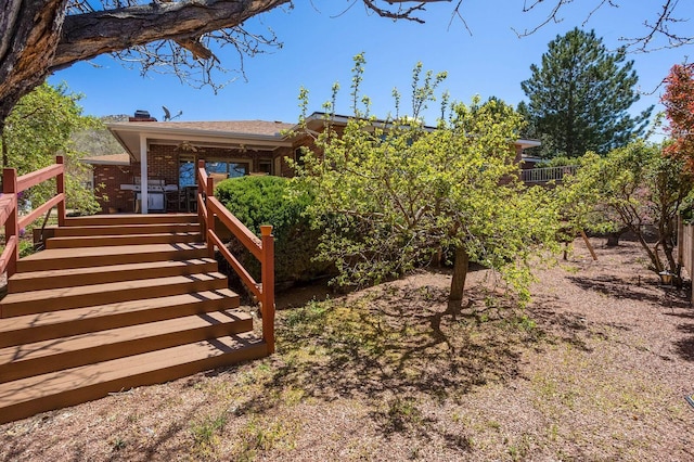 view of yard with a wooden deck