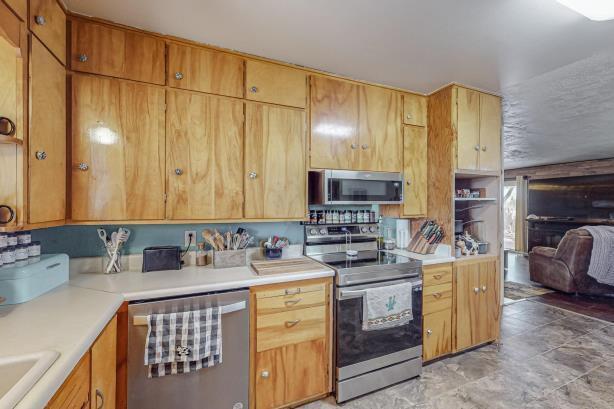 kitchen featuring appliances with stainless steel finishes and light tile floors