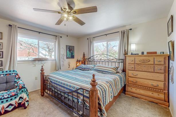 carpeted bedroom with ceiling fan