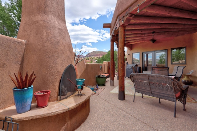 view of patio featuring grilling area, french doors, and ceiling fan