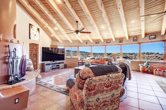 tiled living room featuring wood ceiling, plenty of natural light, beam ceiling, and high vaulted ceiling