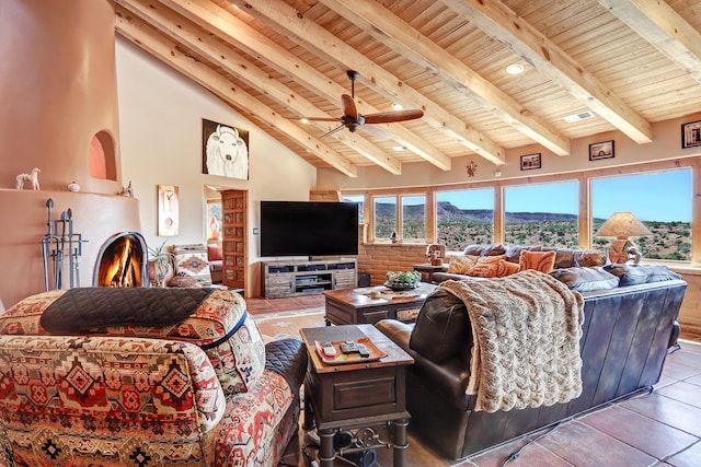 living room with high vaulted ceiling, wooden ceiling, beamed ceiling, and ceiling fan