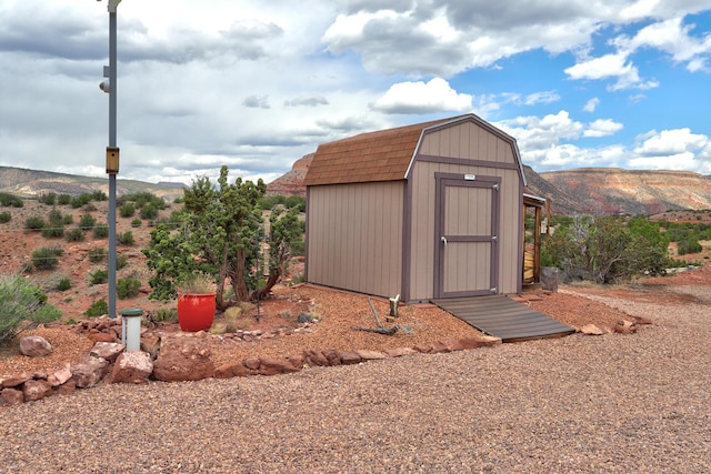 view of outbuilding featuring a mountain view