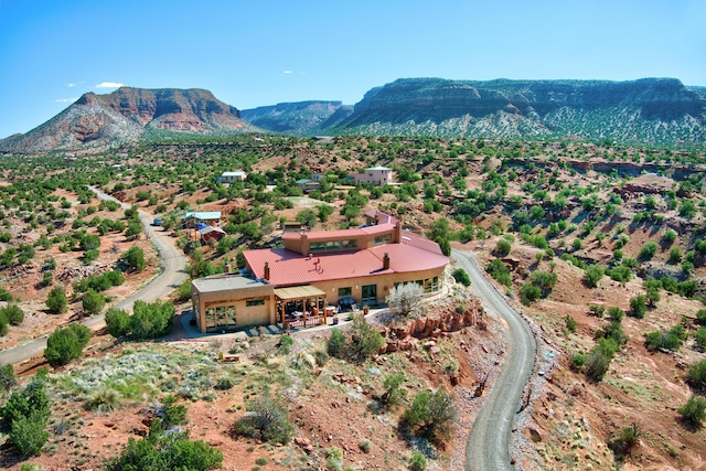 birds eye view of property with a mountain view