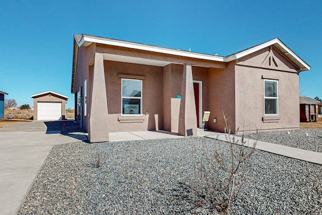 exterior space with an outdoor structure and a garage