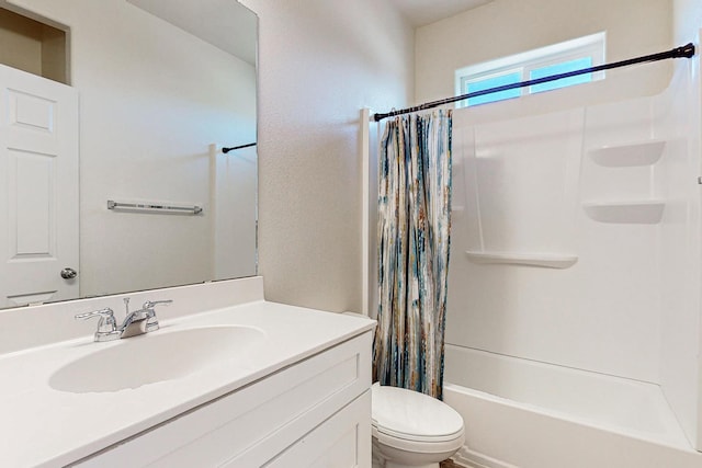 full bathroom with vanity, toilet, and shower / bath combo with shower curtain