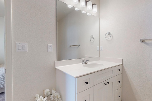 bathroom featuring vanity with extensive cabinet space