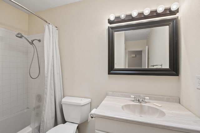 bathroom featuring toilet, shower / tub combo, and vanity