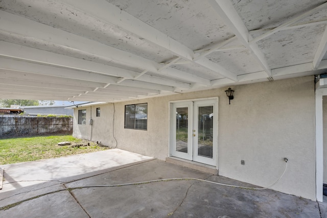 view of patio / terrace featuring french doors and fence