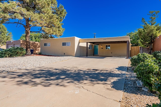 southwest-style home with a carport