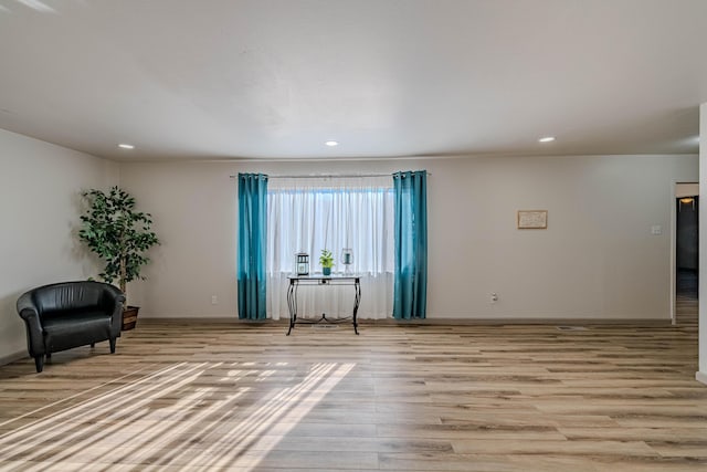 sitting room with light hardwood / wood-style floors