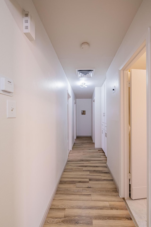 hallway featuring light wood-type flooring